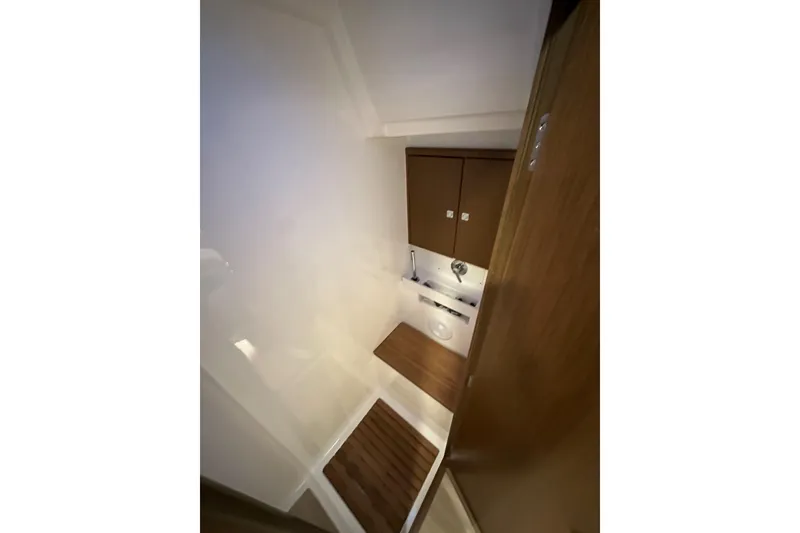 Slide: The Image of 2020 Bavaria C50 yacht bathroom with wooden accents and modern fixtures. - 73