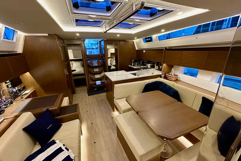 Slide: The Image of Luxurious interior of a 2020 Bavaria C50 yacht with modern furnishings and ample natural light. - 78