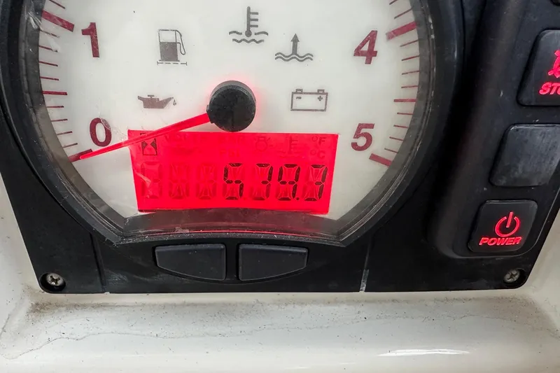 Slide: The Image of Close-up of Bavaria C50 2020 boat gauge displaying 570.8 hours with power button. - 81