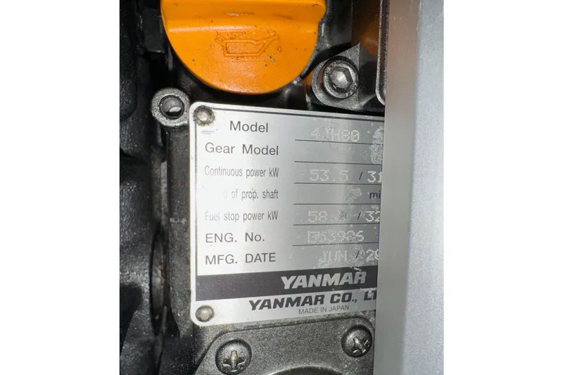 Slide: The Image of Engine plate of a Yanmar model, showing specifications and manufacturing details. - 85