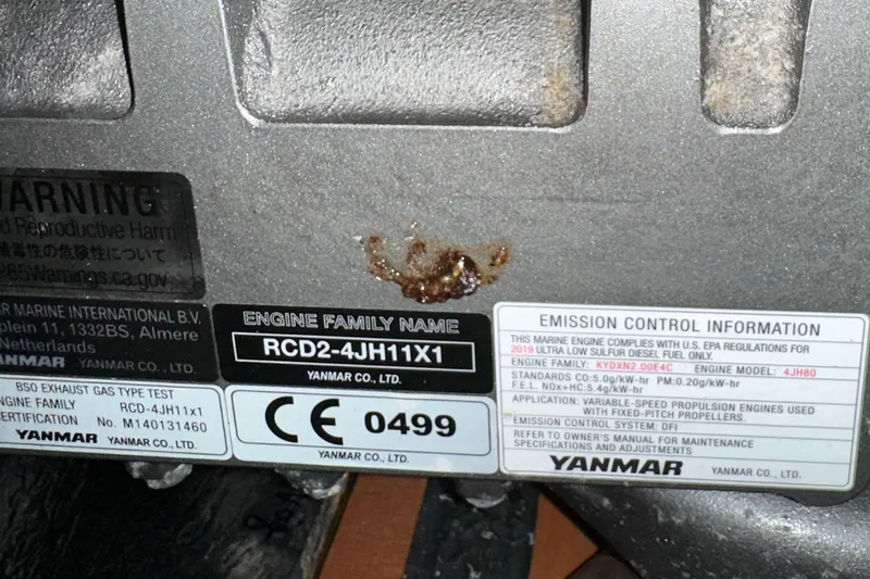 Slide: The Image of Engine label on a 2020 Bavaria C50, featuring Yanmar emission control information. - 86