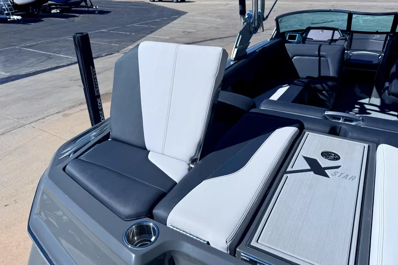 Slide: The Image of 2020 MasterCraft XStar boat interior with sleek seating and stylish design. - 13