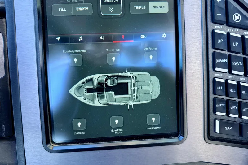 Slide: The Image of Touchscreen control panel of a 2020 MasterCraft XStar boat, displaying lighting and audio options. - 22