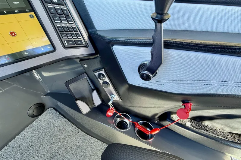 Slide: The Image of 2020 MasterCraft XStar boat dashboard with control panel and safety features. - 23