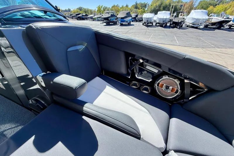 Slide: The Image of 2020 MasterCraft XStar interior with sleek seating and built-in speaker system. - 26