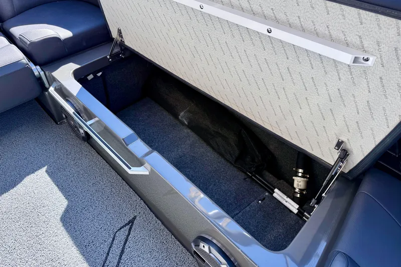 Slide: The Image of Open storage compartment in 2020 MasterCraft XStar boat, showcasing spacious interior. - 29