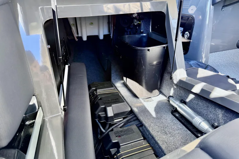 Slide: The Image of Interior storage compartment of a 2020 MasterCraft XStar boat, featuring organized equipment. - 30