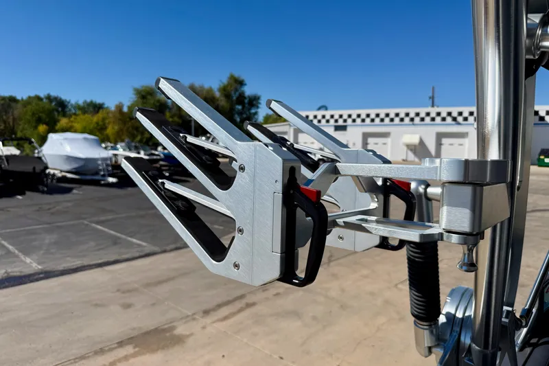 Slide: The Image of MasterCraft XStar 2020 boat wakeboard rack in a sunny outdoor setting. - 39