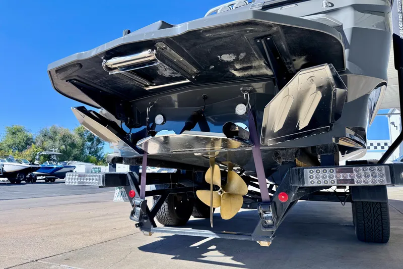 Slide: The Image of 2020 MasterCraft XStar boat on trailer, showcasing propeller and hull design. - 6