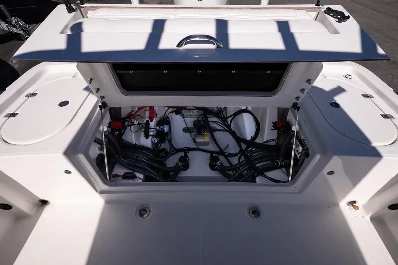 Slide: The Image of 2026 Blazer Bay Makaira 2800 boat storage compartment with wiring and equipment. - 12