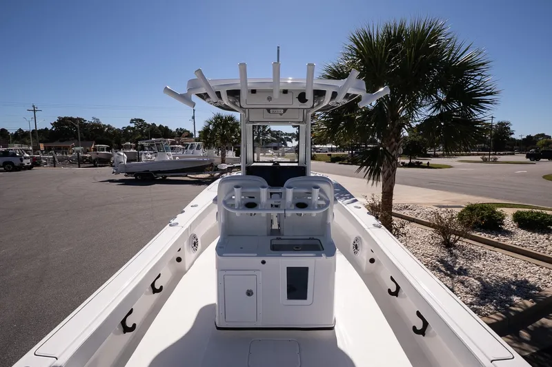 Slide: The Image of 2026 Blazer Bay Makaira 2800 boat, sleek design, parked near palm trees. - 13