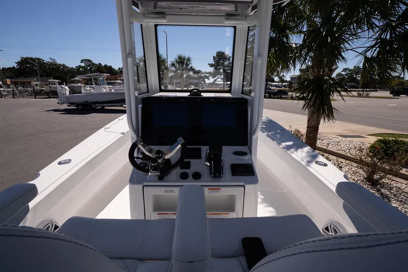 Slide: The Image of 2026 Blazer Bay Makaira 2800 boat interior with steering console and dual screens. - 16