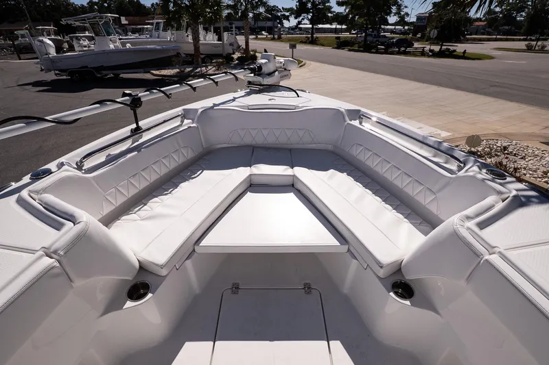 Slide: The Image of 2026 Blazer Bay Makaira 2800 boat interior with white cushioned seating and modern design. - 24