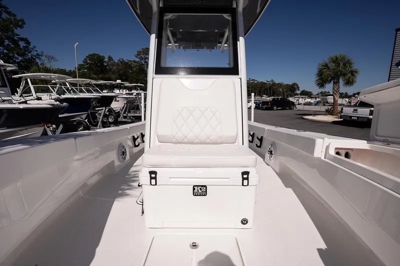 Slide: The Image of 2026 Blazer Bay Makaira 2800 boat interior with white seating and storage. - 27