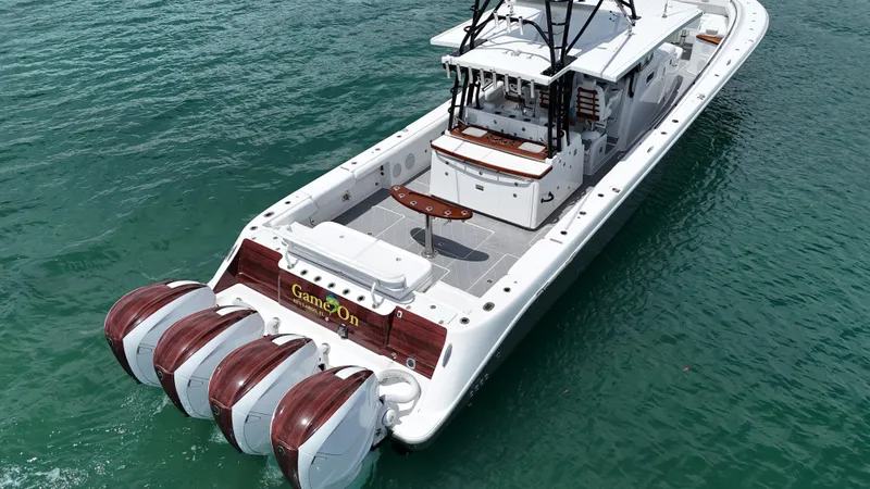 Slide: The Image of 2019 HCB 53 Sueños boat with four powerful engines on clear water. - 16