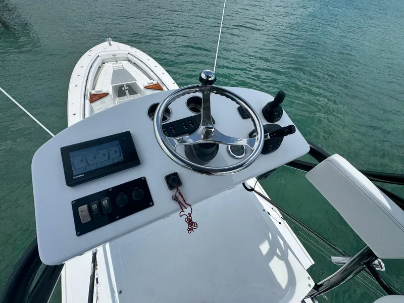 Slide: The Image of Helm of 2019 HCB 53 Sueños boat with steering wheel and controls. - 21
