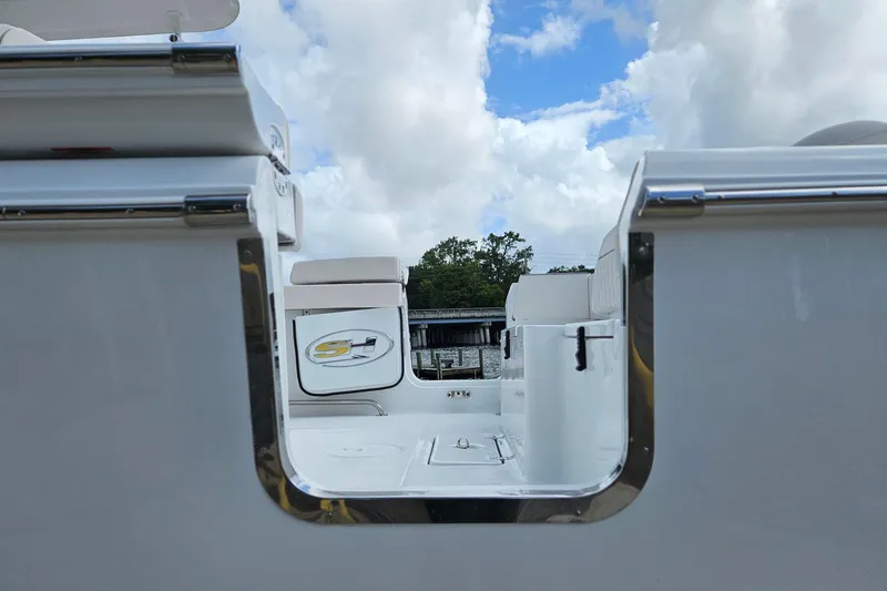 Slide: The Image of 2026 Sea Hunt Ultra 305 SE boat interior with sleek design and chrome accents. - 32