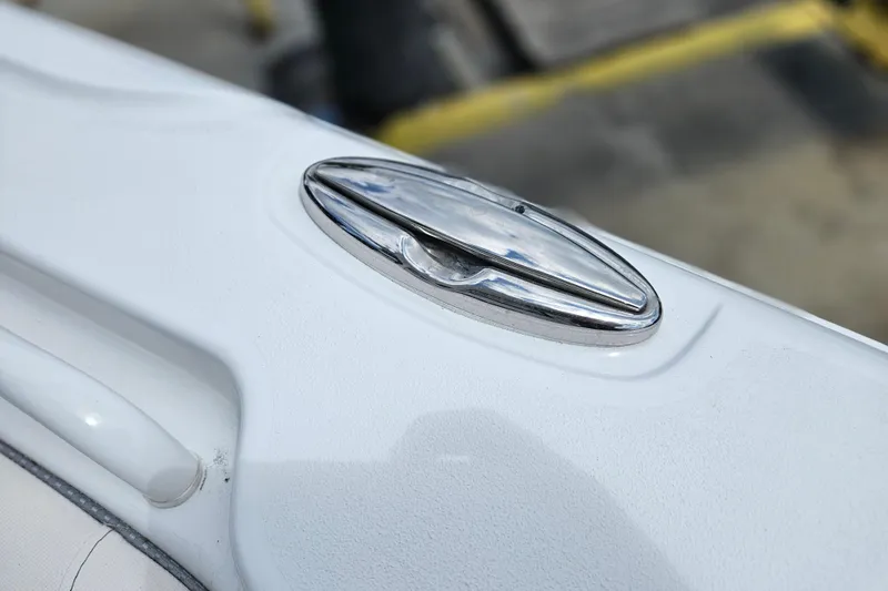 Slide: The Image of Close-up of a 2026 Sea Hunt Ultra 305 SE boat cleat on a white surface. - 36