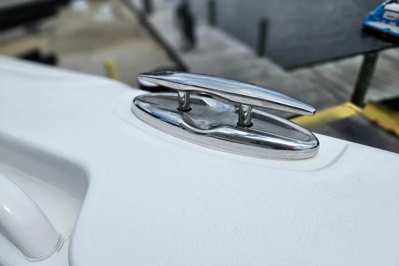 Slide: The Image of 2026 Sea Hunt Ultra 305 SE boat cleat on deck, dockside view. - 38