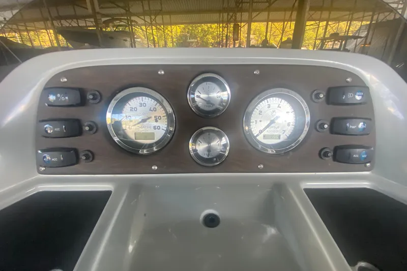 Slide: The Image of Dashboard of 2019 Manitou Aurora LE 23 RF VP boat with gauges and controls. - 17