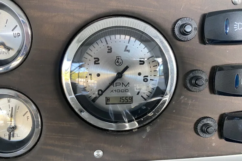 Slide: The Image of Dashboard of 2019 Manitou Aurora LE 23 RF VP showing RPM gauge and controls. - 19