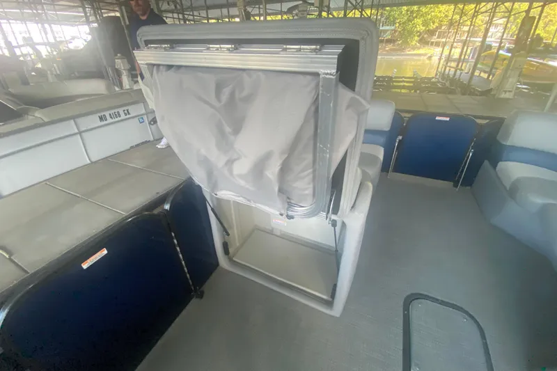 Slide: The Image of 2019 Manitou Aurora LE 23 RF VP pontoon boat interior with seating and storage. - 21