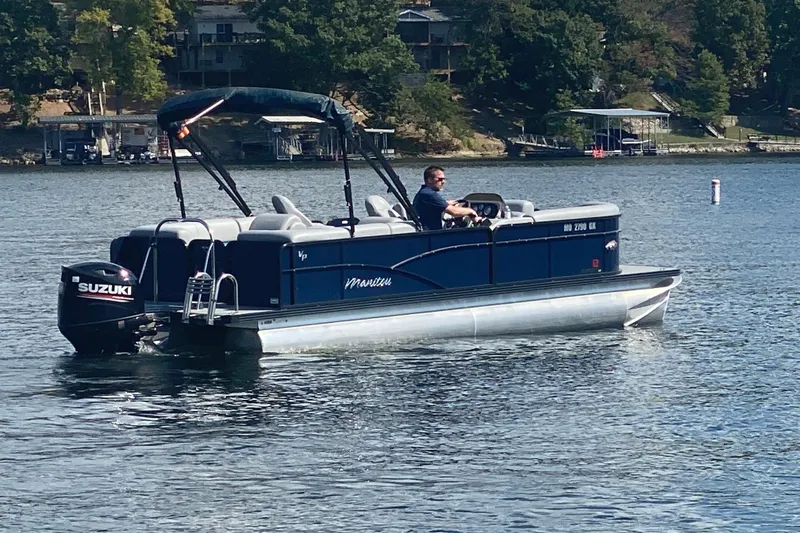 Slide: The Image of 2019 Manitou Aurora LE 23 RF VP pontoon boat on a lake with Suzuki outboard motor. - 5