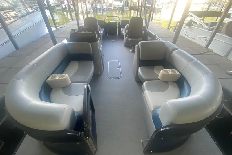Slide: The Image of 2019 Manitou Aurora LE 23 RF VP pontoon boat interior with spacious seating and cup holders. - 8