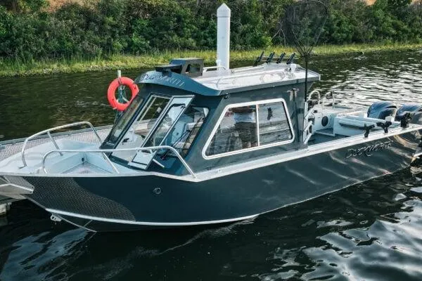 Slide: The Image of 2026 Duckworth 26 Pacific Pro boat on water, featuring sleek design and fishing equipment. - 3