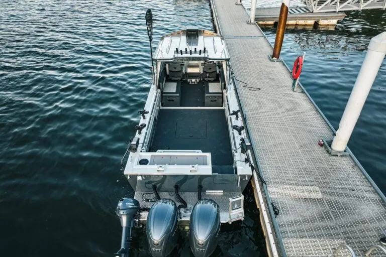 Slide: The Image of 2026 Duckworth 26 Pacific Pro boat docked with dual engines, viewed from above. - 4