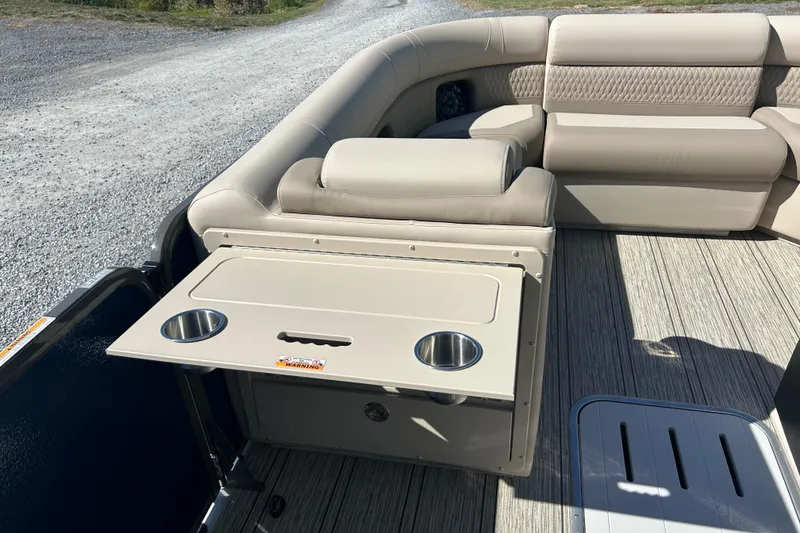 Slide: The Image of 2026 Premier 230 Solaris RF boat interior with beige seating and foldable table. - 17