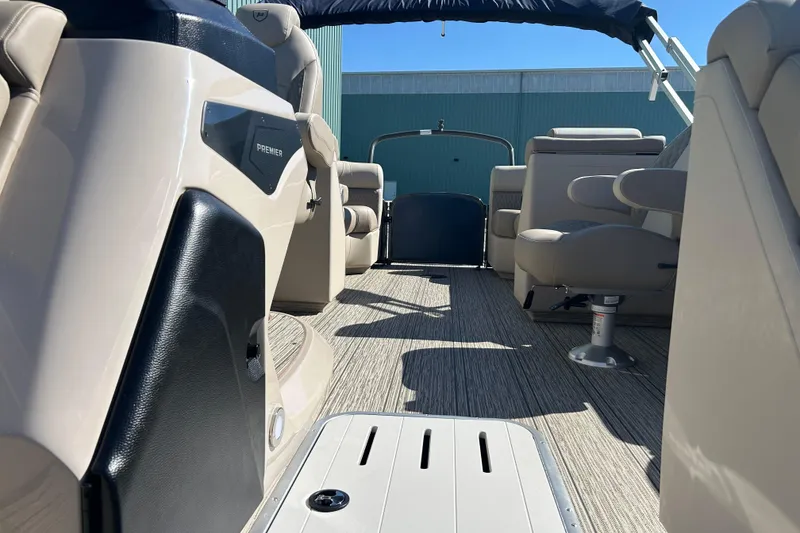 Slide: The Image of 2026 Premier 230 Solaris RF boat interior with beige seating and modern design. - 20