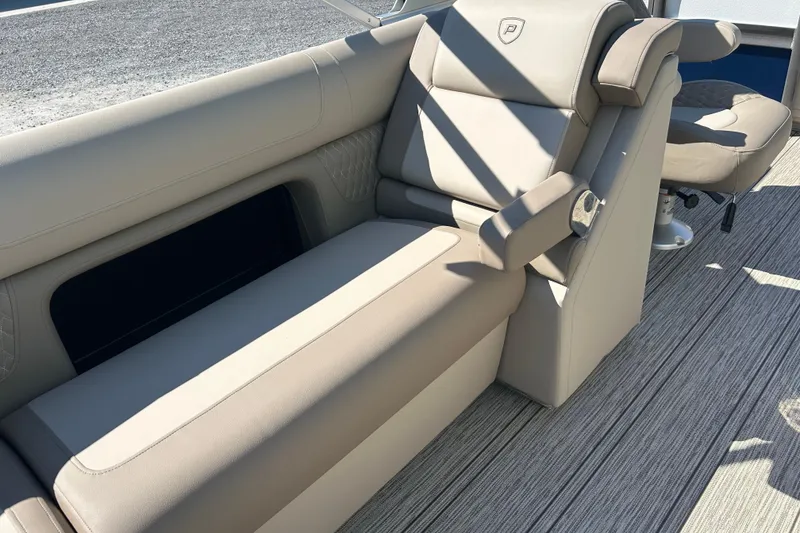 Slide: The Image of Luxurious seating on 2026 Premier 230 Solaris RF boat, featuring beige upholstery and modern design. - 21
