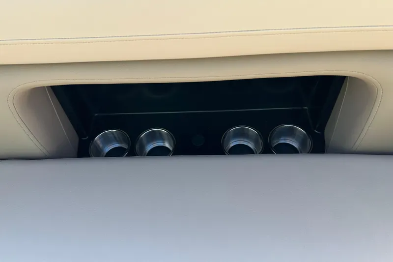 Slide: The Image of Cup holders in the 2026 Premier 230 Solaris RF boat's beige interior. - 22