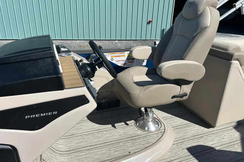 Slide: The Image of Captain's chair and helm of 2026 Premier 230 Solaris RF boat. - 27