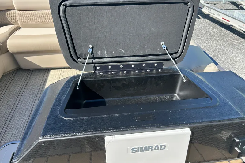 Slide: The Image of Open storage compartment on 2026 Premier 230 Solaris RF boat with Simrad equipment. - 29