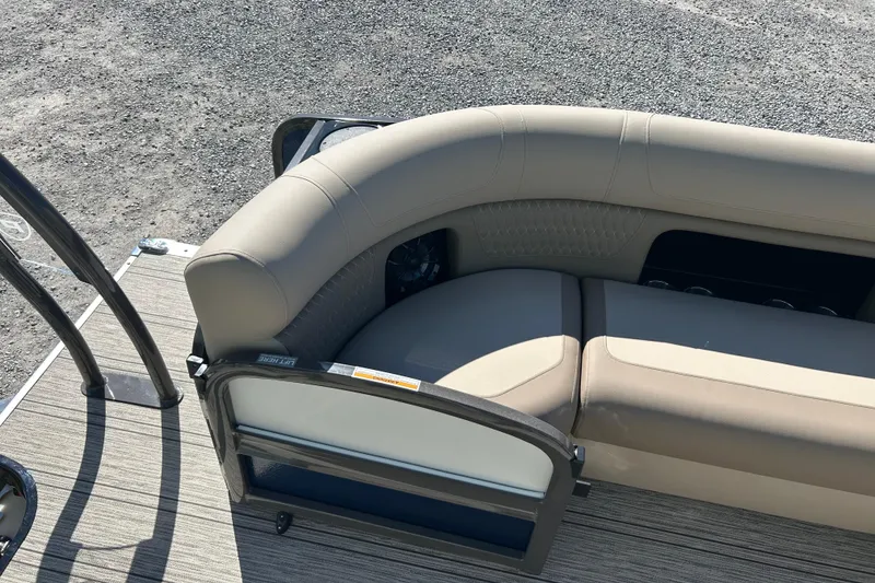 Slide: The Image of Premier 230 Solaris RF 2026 boat interior with beige seating and textured flooring. - 33