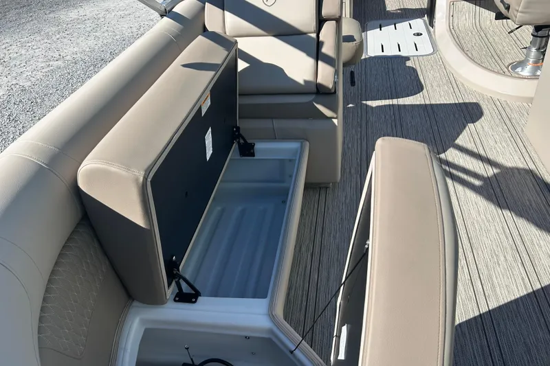 Slide: The Image of Interior view of 2026 Premier 230 Solaris RF boat with open storage compartments. - 36