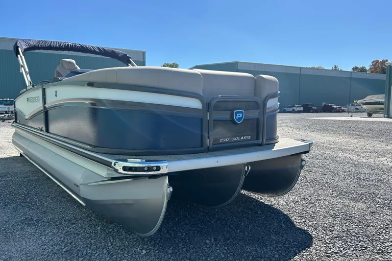 Slide: The Image of 2026 Premier 230 Solaris RF pontoon boat on gravel lot, sunny day. - 5