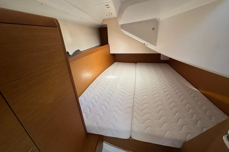 Slide: The Image of Cozy cabin interior of 2020 Jeanneau Sun Odyssey 349 with comfortable mattress. - 29