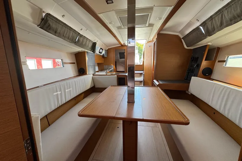 Slide: The Image of Interior of 2020 Jeanneau Sun Odyssey 349 sailboat, featuring a spacious dining area. - 32