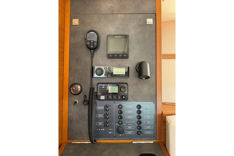 Slide: The Image of Control panel of a 2020 Jeanneau Sun Odyssey 349 sailboat with navigation equipment. - 38