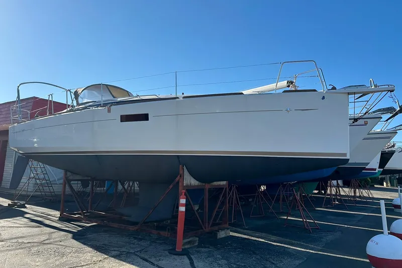 Slide: The Image of 2020 Jeanneau Sun Odyssey 349 sailboat on dry dock, side view. - 4