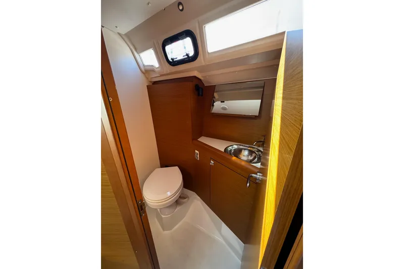 Slide: The Image of Modern bathroom in 2020 Jeanneau Sun Odyssey 349 yacht, featuring toilet and sink. - 40