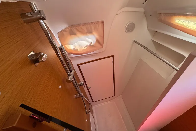 Slide: The Image of Interior of 2020 Jeanneau Sun Odyssey 349 yacht bathroom with wooden accents and modern fixtures. - 42