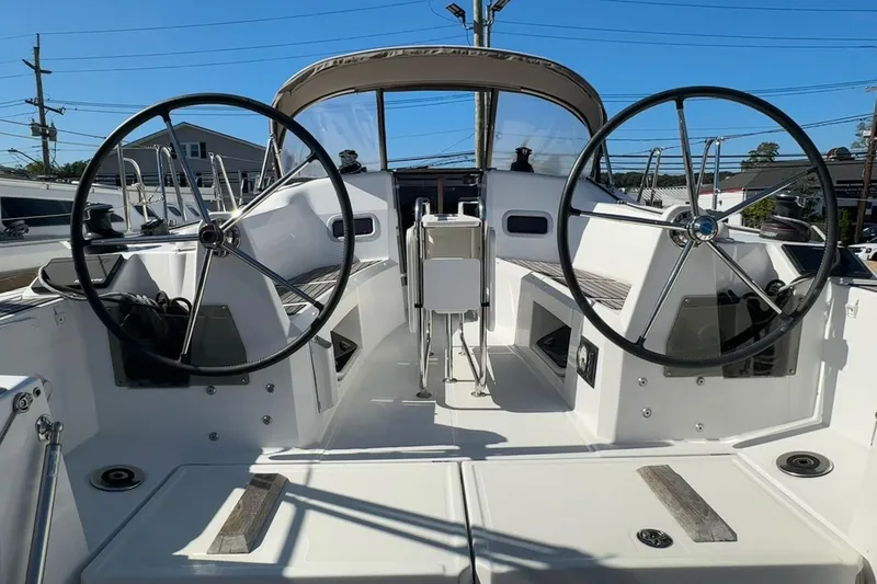 Slide: The Image of 2020 Jeanneau Sun Odyssey 349 cockpit with dual steering wheels and modern design. - 6