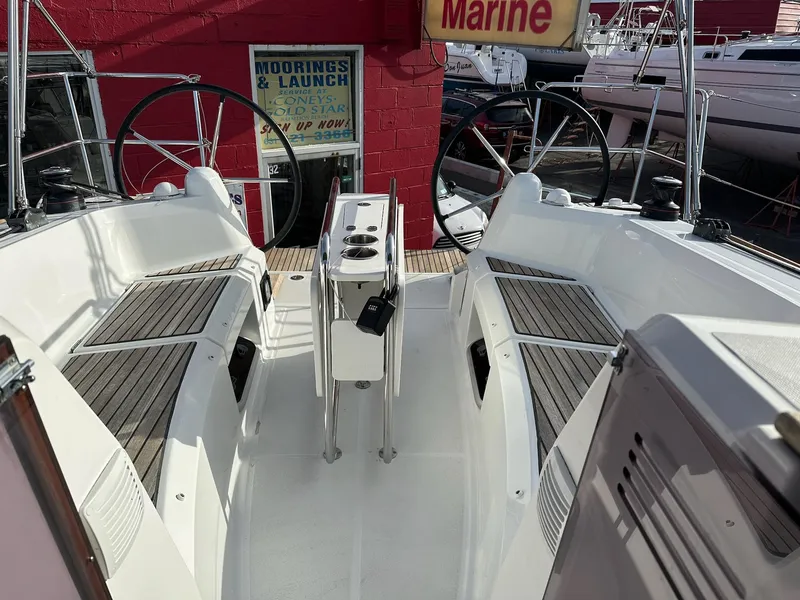 Slide: The Image of Cockpit of 2020 Jeanneau Sun Odyssey 349 sailboat with dual steering wheels. - 7