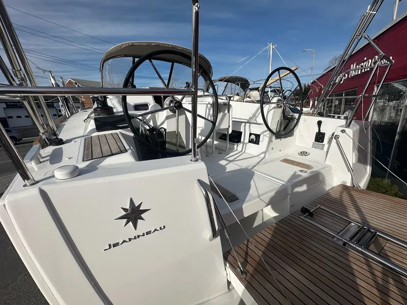 Slide: The Image of 2020 Jeanneau Sun Odyssey 349 sailboat with dual steering wheels and teak deck. - 8