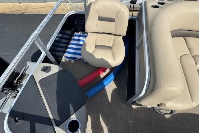 Slide: The Image of 2022 Sun Tracker Bass Buggy 18 DLX interior with seating and accessories. - 12