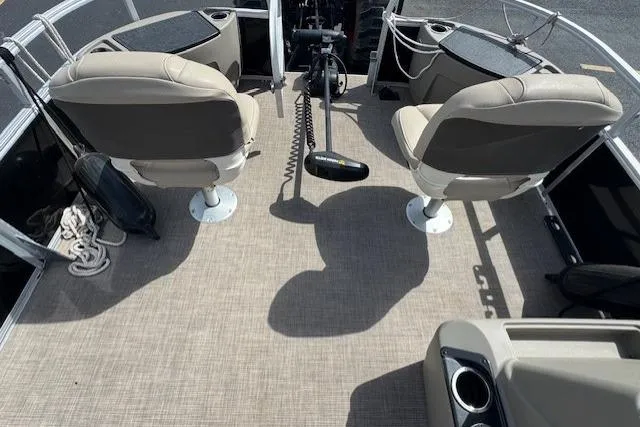 Slide: The Image of 2022 Sun Tracker Bass Buggy 18 DLX interior with two swivel seats and control console. - 15